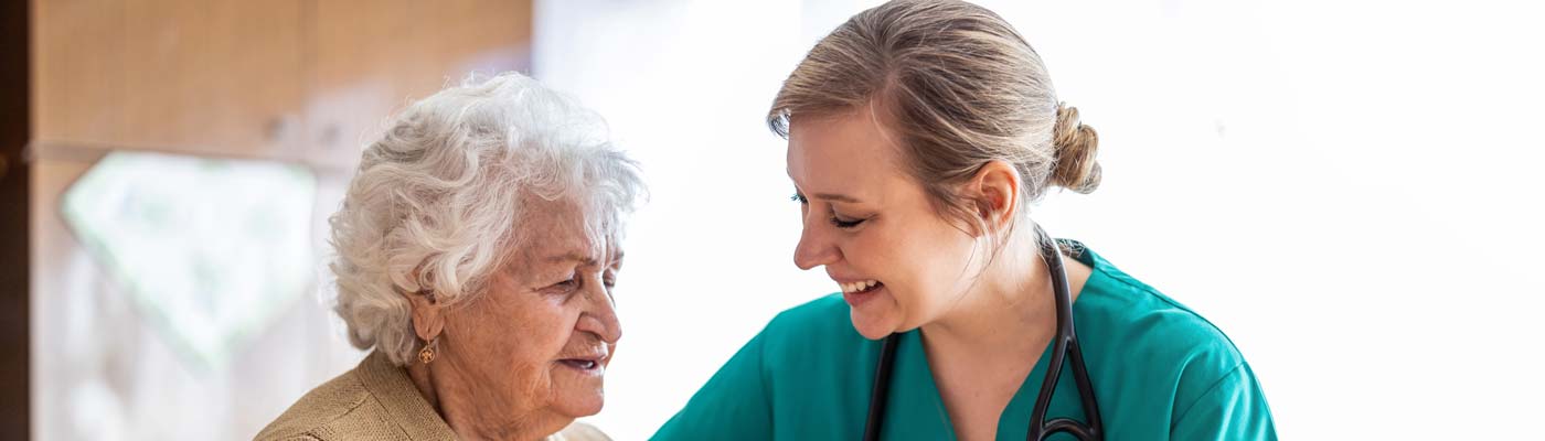 health care worker with older woman