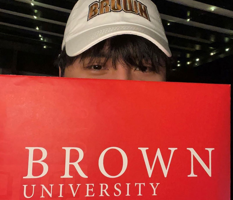 Gilbert Solano with Brown University Sign