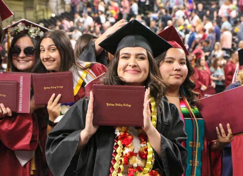 Students smiling at commencement ceremony