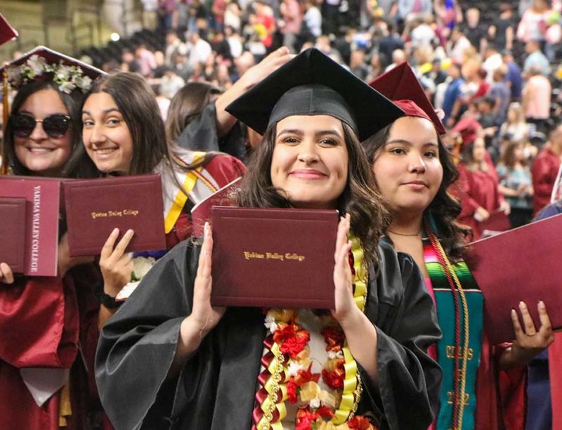 Students smiling at commencement ceremony
