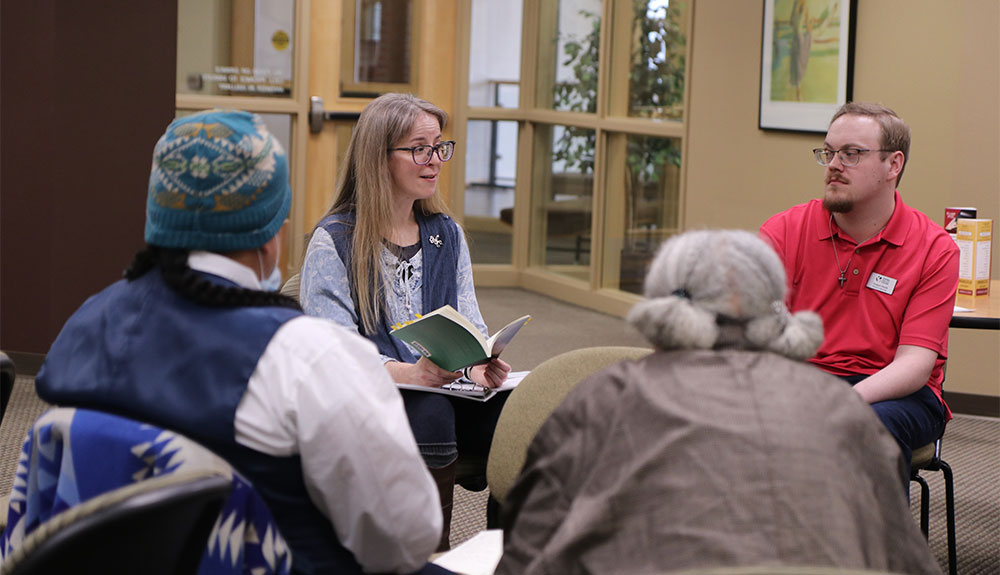 Woman reads during a poetry reading event