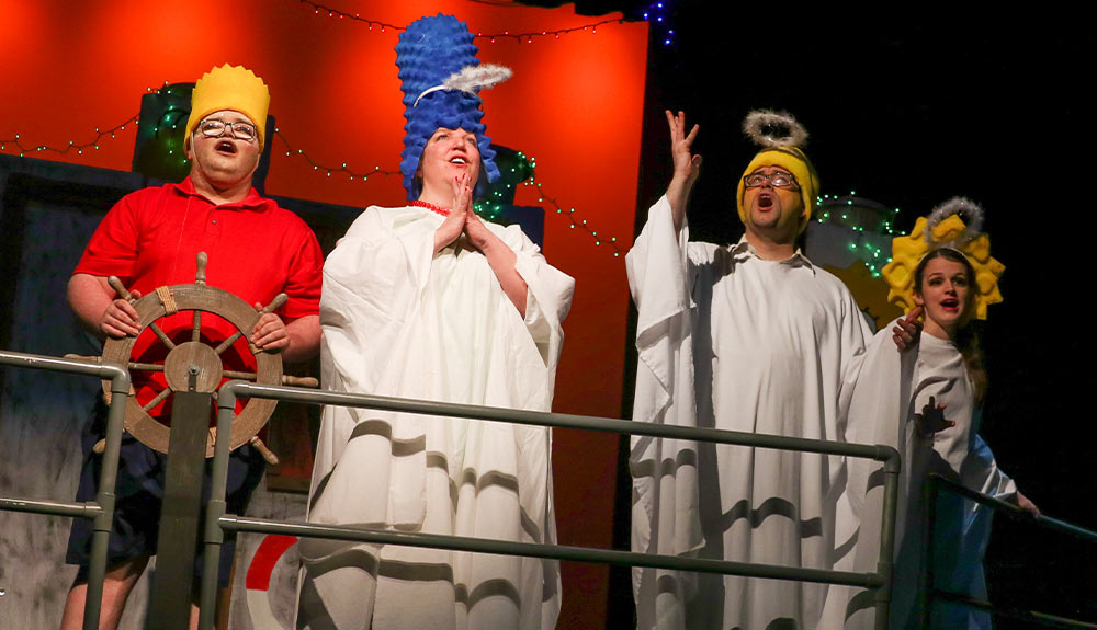 Actors portraying characters from "The Simpsons" on stage