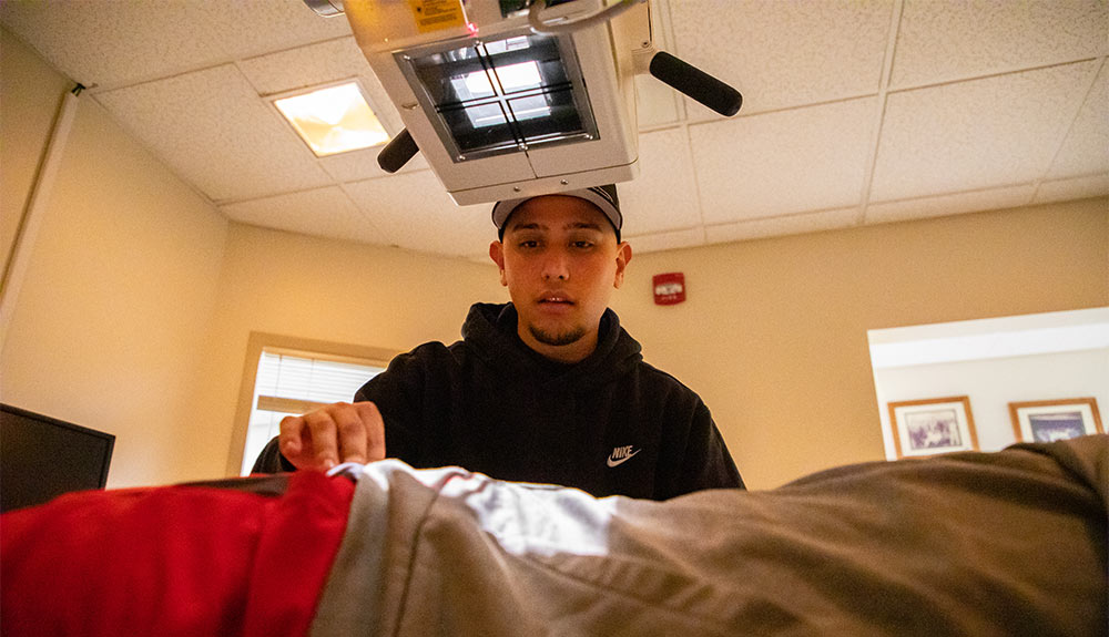 Radiologic sciences student prepares to take an image in class