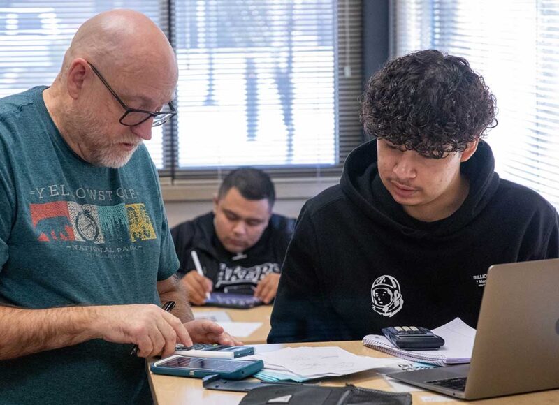 Instructor works with student in the math center