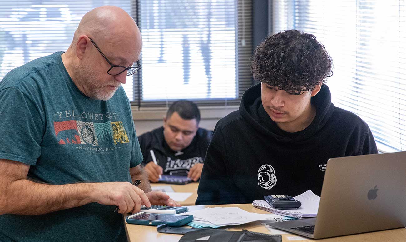 Instructor works with student in the math center