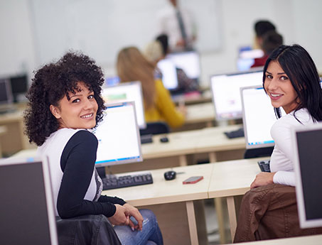 smiling students in computer lab