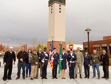 veterans in front of tower