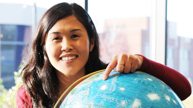 student with a globe
