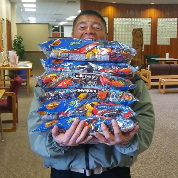 Otto Cruz helping get candy ready for YVC's harvest fest