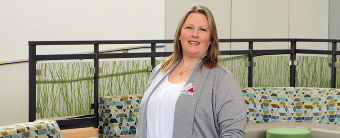 Libby McRae poses for a picture in the lobby of the Allied Health building on YVC's Yakima Campus