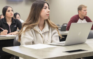 Students listen to a guest speak in a recent BASM class