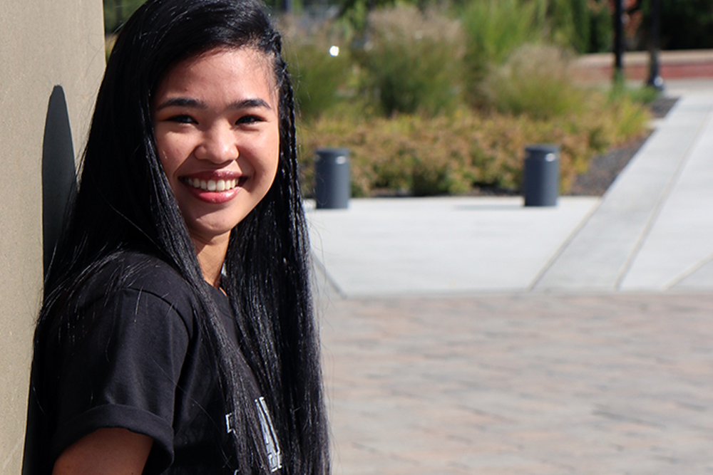 Andrea Picardal poses for Student Story picture outside on the YVC campus.