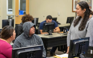 YVC staff helps students complete their financial aid applications during a recent workshop