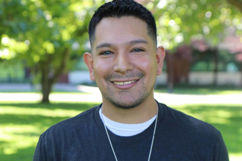 Miguel Blancas-Alejo poses for Student Story photo on the grounds of the YVC Campus.
