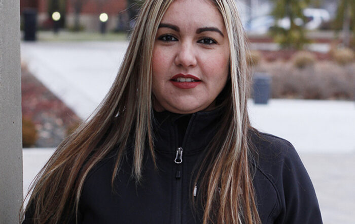 Soledad Gonzalez poses for Student Story picture outside on the YVC campus.