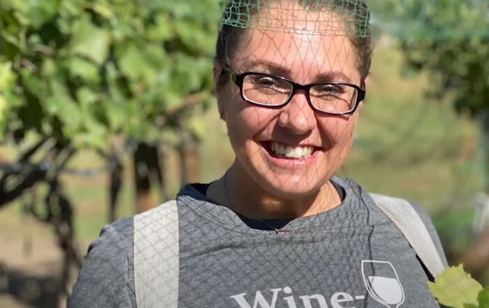 Tiffany Britton poses for Student Story picture in a local Vineyard.